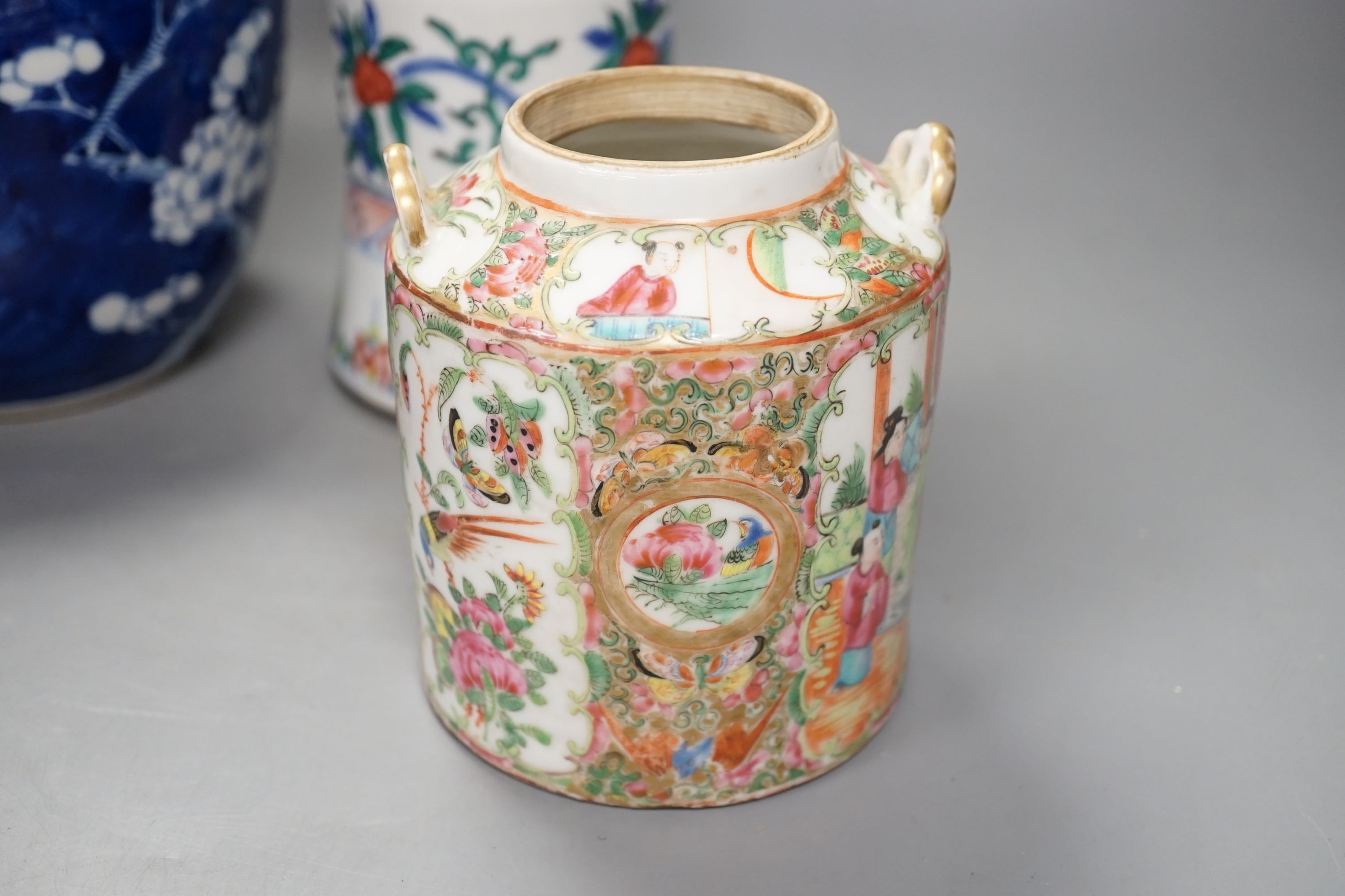 A Chinese prunus jar and cover, a polychrome vase and a famille rose jar, 24cms high.